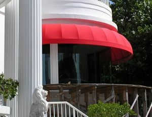 Red awning fabric on a residential awning