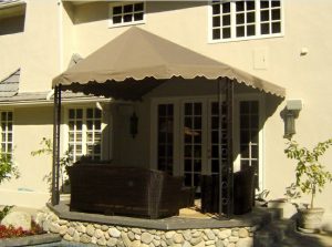 Sandy colored awning fabric on a residential patio shade awning