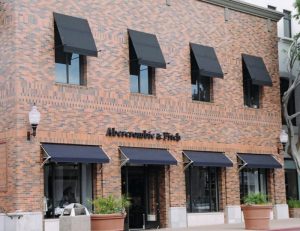 Black and navy blue commercial window awnings for Abercrombie & Fitch