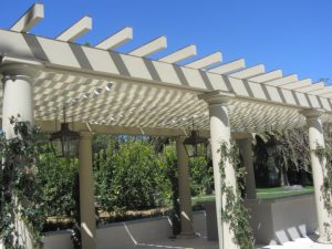 Custom trellis cover with white slide on wire awning fabric