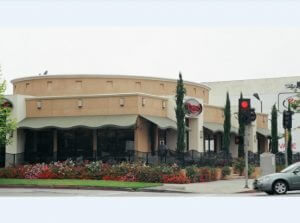 Olive green storefront awning for a restaurant