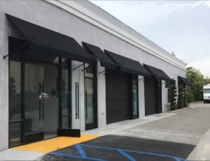 Commercial window awnings with spearhead awning poles