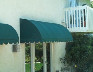 Green awning fabric on a residential porch awning