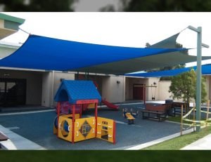 Blue sun shade panels for an outdoor playground