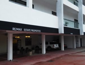Black commercial awning for RE/MAX Estate Properties