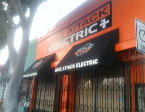 Black commercial awnings for Bike Attack Electric