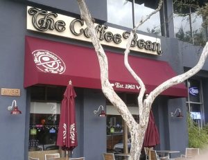 The Coffee Bean's commercial awning with red awning fabric