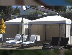 Residential cabanas with white and blue awning fabric