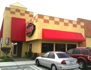 Custom commercial awnings for Shakey's with red awning fabric