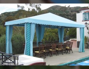 Pool cabana with light blue awning fabric