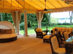 Large patio shade awning with yellow awning fabric