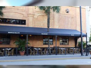 Black storefront awning for a restaurant patio