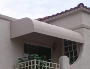 Tan awning fabric on a residential porch awning