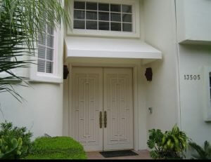 Residential entrance awning with white awning fabric