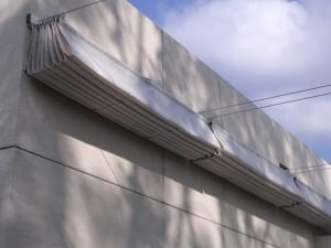 White retracted slide on wire awning