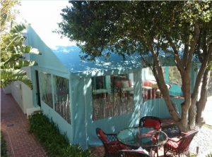 Patio shade awning with custom baby blue awning fabric and clear plastic panels