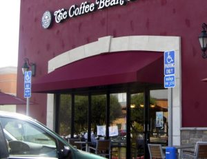 Red commercial awning for The Coffee Bean