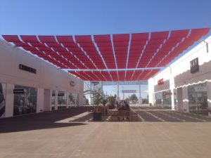 Red commercial slide on wire awning