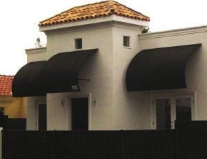 Residential awnings with black awning fabric and custom lettering