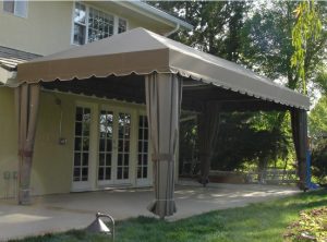 Outdoor patio shade awning with olive awning fabric