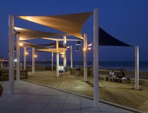 Orange sun shade panels on a boardwalk