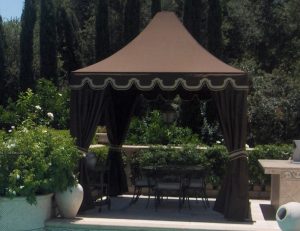 Pool cabana with brown awning fabric