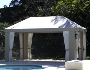 Custom cabana with grey awning fabric and white drapes