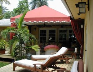 Residential cabana with red awning fabric