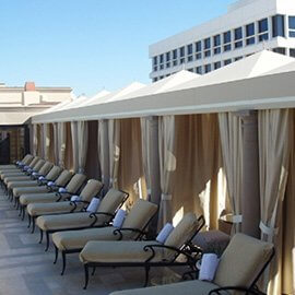 Pool cabanas and drapes with light colored fabric