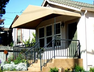 Residential entrance awning with yellow awning fabric