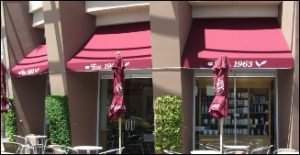 Dark red window canopy and awning graphics in Van Nuys