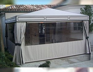 Patio shade awning with white awning fabric and clear plastic panels