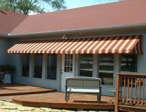 Residential patio awning with striped awning fabric