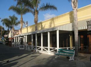 Striped storefront awning with white beams