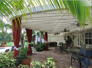 Custom patio shade awning with red drapes