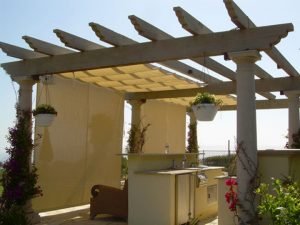 Trellis cover with white slide wire awning