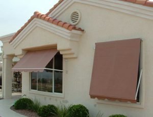 Rust colored residential retractable window awnings
