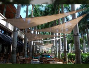 Commercial sun shade sail with light brown awning fabric