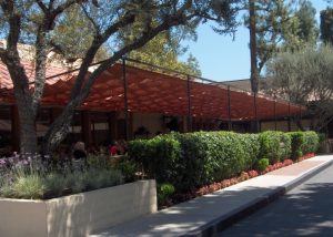 Commercial slide on wire awning with red awning fabric