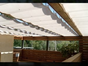 Residential slide on wire awning with white awning fabric