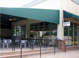 Green storefront awning and green patio awning