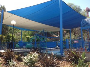 Custom blue and grey fabric cover at an amusement park