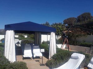 Building custom cabanas in Ojai Valley with blue and white awning fabric